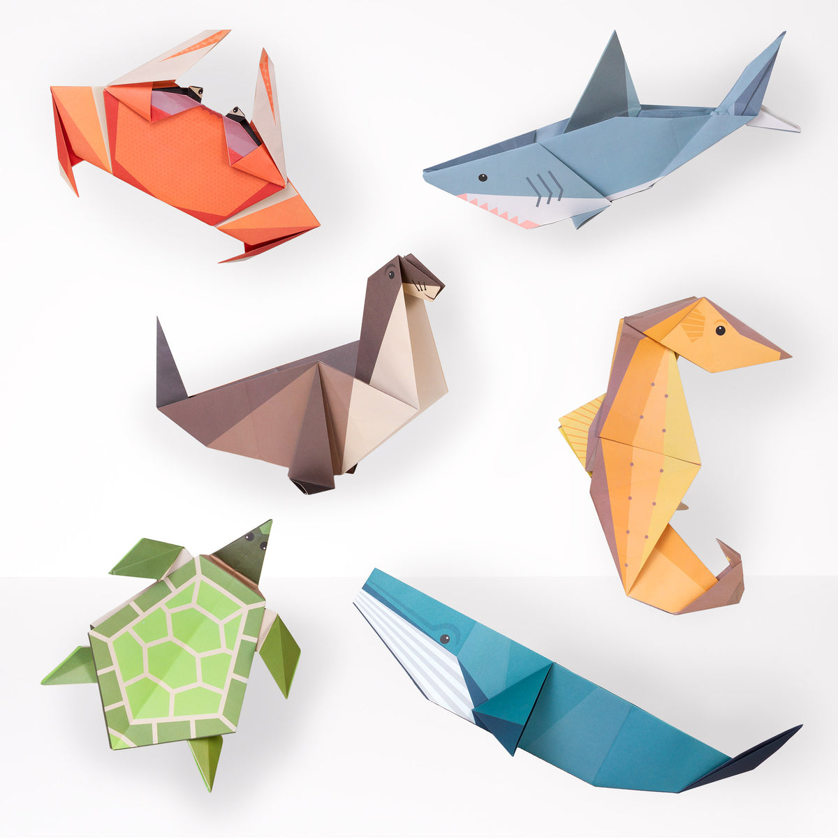 Crab, Shark, Seal, Seahorse, Turtle and whale origami figure on white background