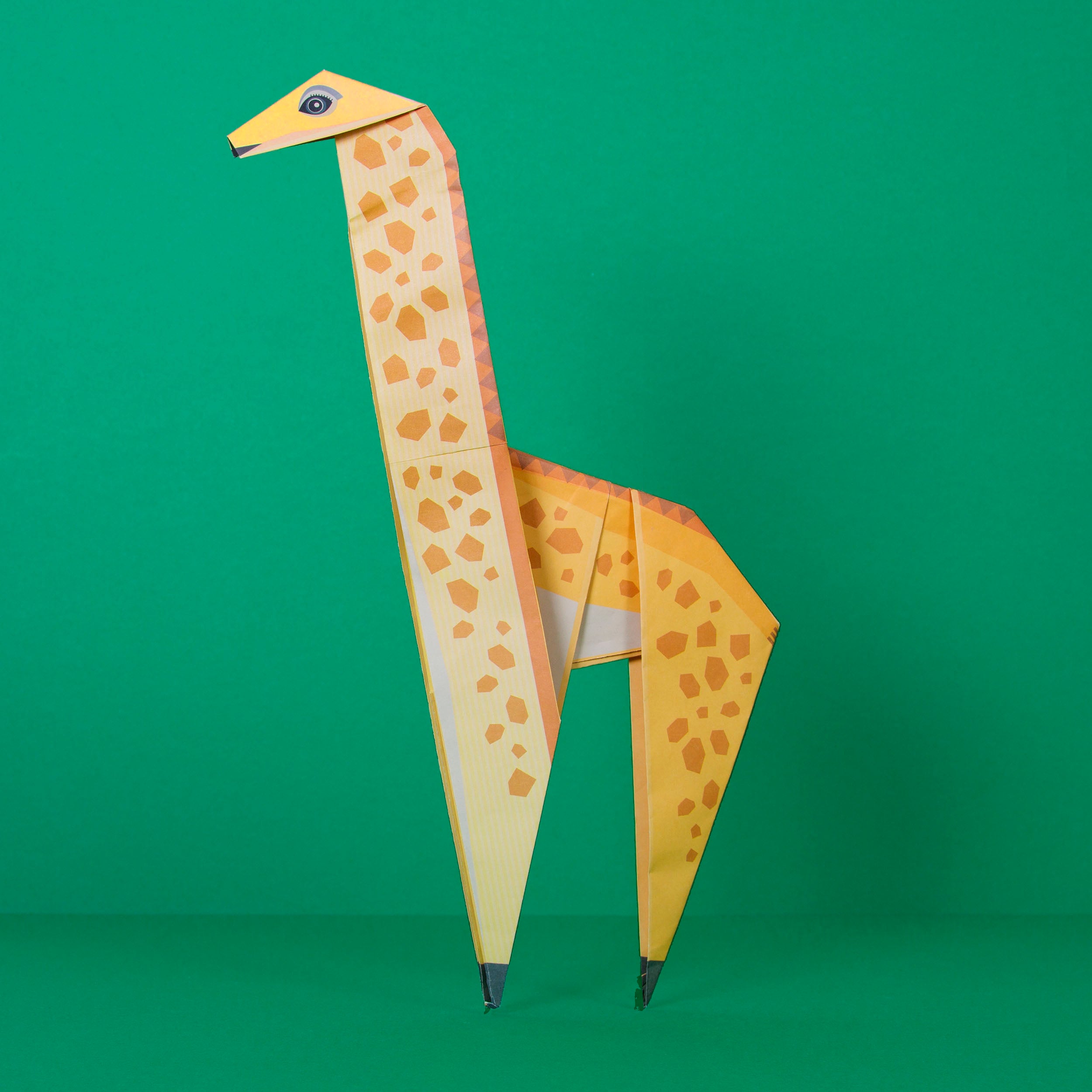 Origami Giraffe constructed on green background
