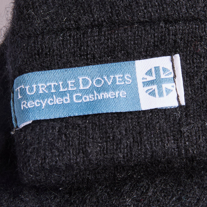 Close up of Turtle doves sewn in label with recycled cashmere