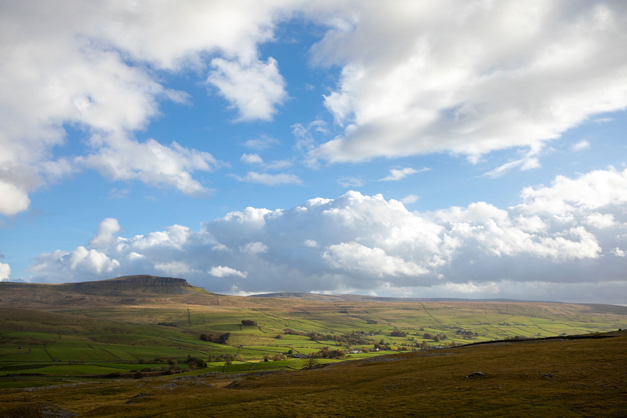 A serene picture of hills and clouds