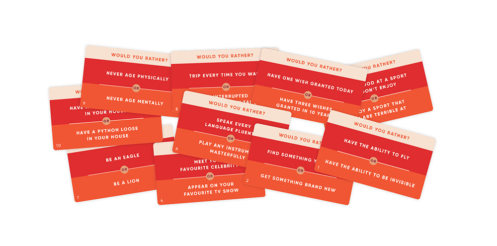 Would you Rather game question cards in red on white surface