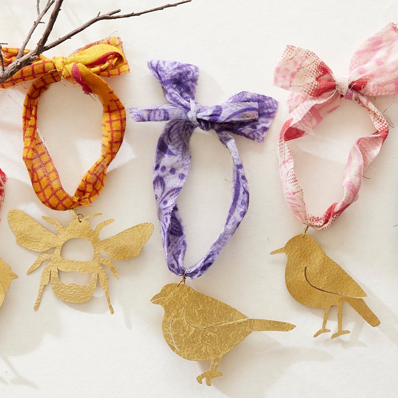 brass bee, robin and grosbeak bird decorations with recycled sari ribbon