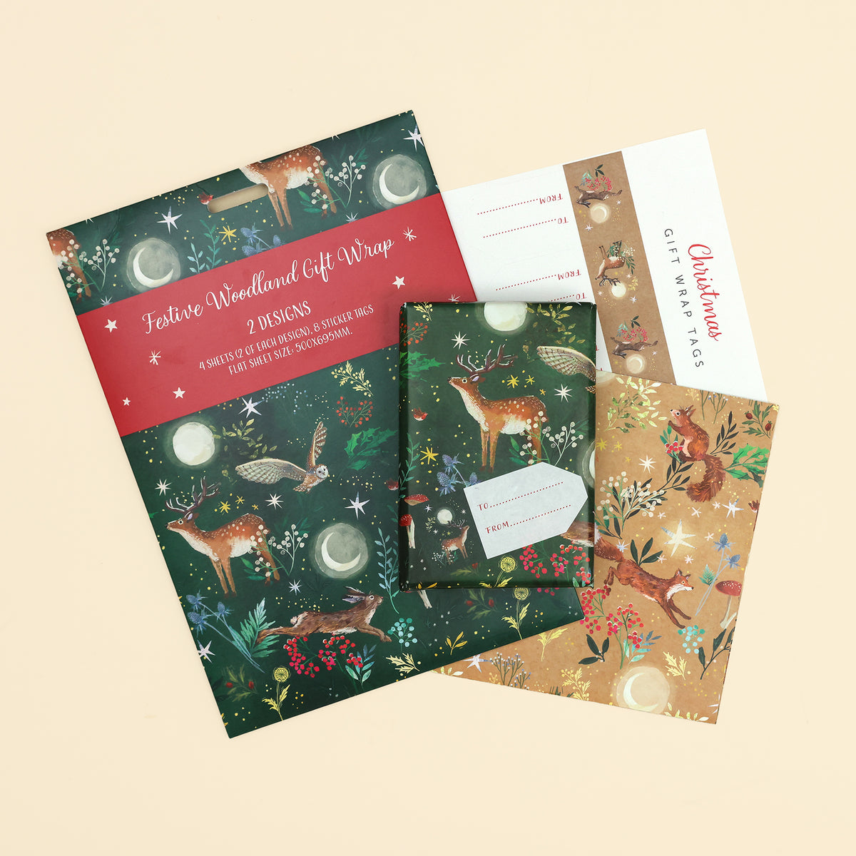 Festive woodlands gift wrapping paper  pack with 4 sheets of wrap (500 x 695mm) in 2 designs of woodlands designs and 8 sticker tags on cream background
