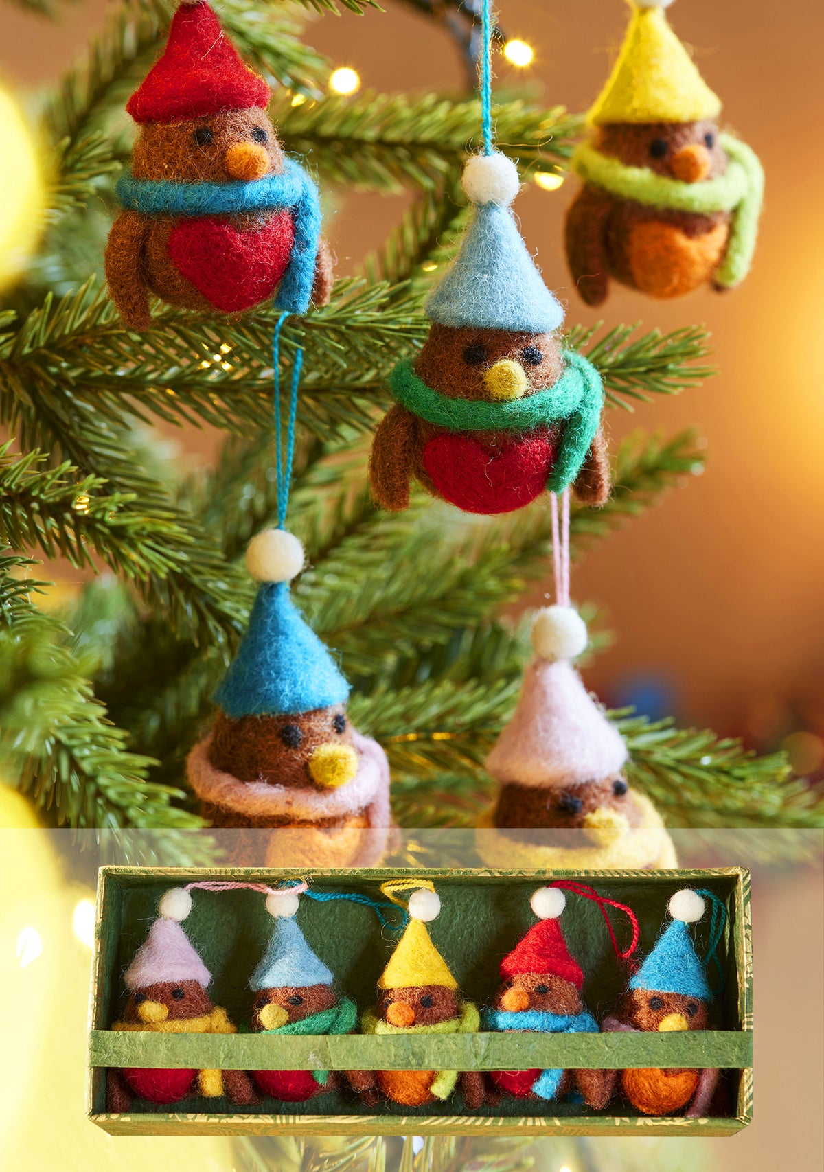 5 Handmade Robin decorations in a mix of colours with bobble hats and scarves made from Felt, hanging in Christmas tree. Picture of box set included