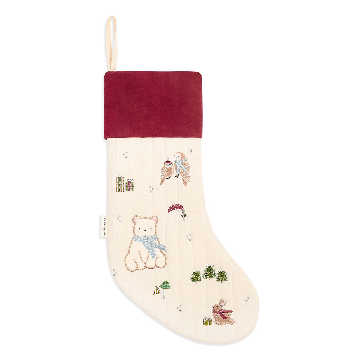 Flat lay of Polar Bear embroidered cotton Christmas stocking on white surface
