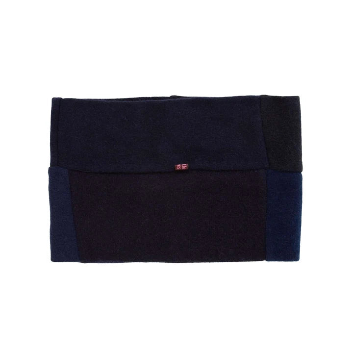 Close up of recycled cashmere neck warmer in black on white surface
