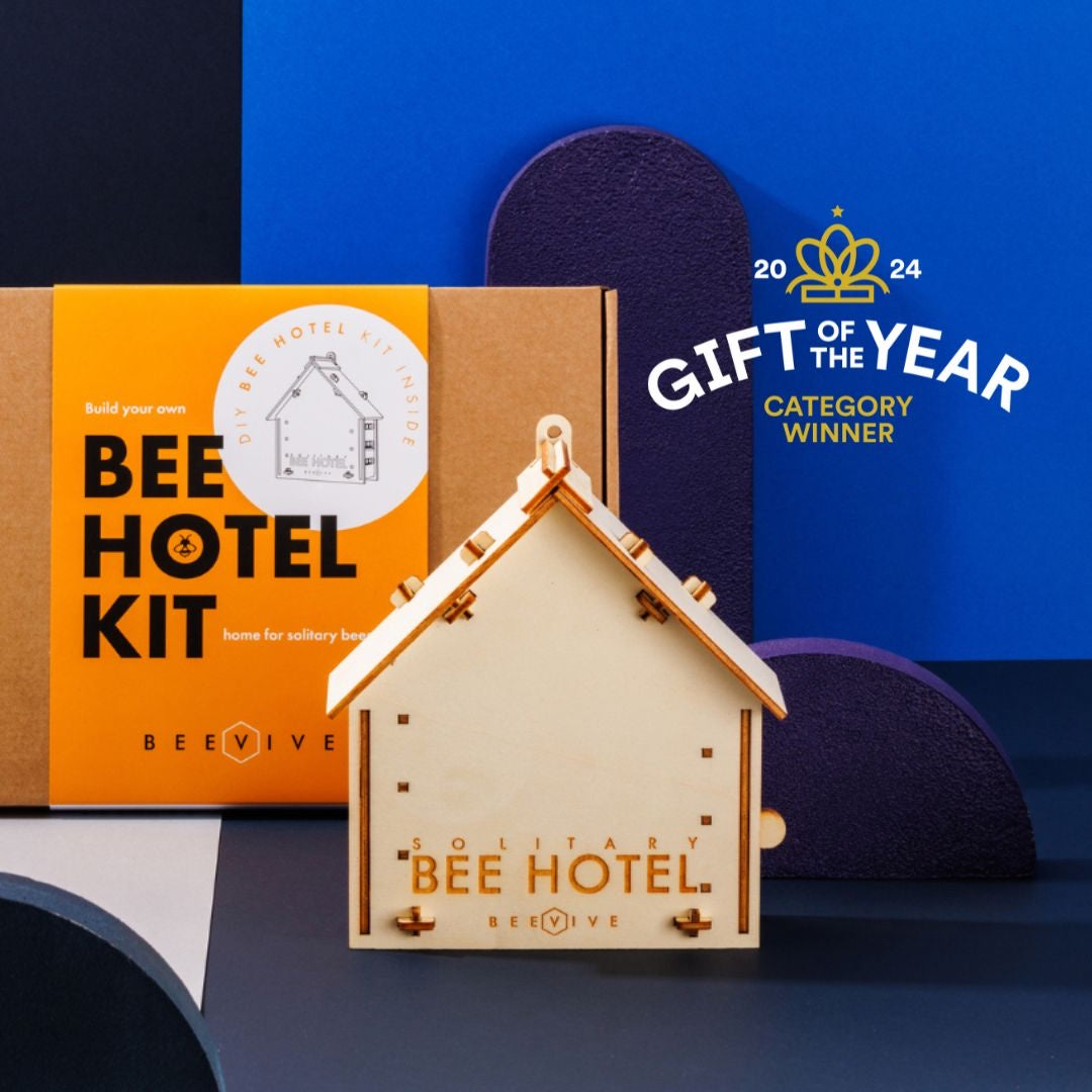 DIY Bee Hotel Kit, a wooden solitary bee hotel in front of its box